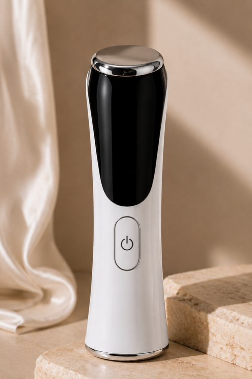 S.Rituelle Recovery Wand in Ivory White, standing on travertine stone with a cream curtain